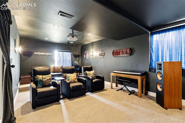6950 Blue Mesa Ln, Littleton, CO 80125 - home theater featuring carpet floors, baseboards, recessed lighting, and a textured ceiling