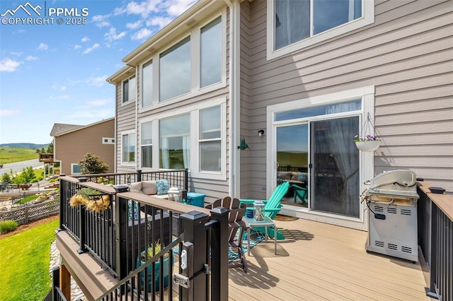 6950 Blue Mesa Ln, Littleton, CO 80125 - wooden deck featuring area for grilling