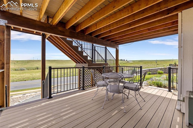 6950 Blue Mesa Ln, Littleton, CO 80125 - deck featuring stairs, a view of countryside, and outdoor dining space