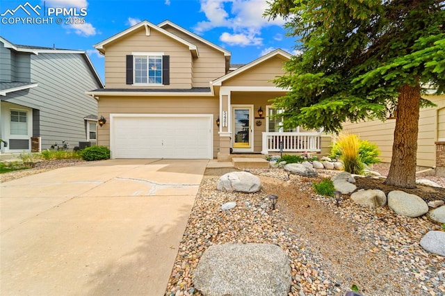 5481 Pioneer Mesa Dr, Colorado Springs, CO 80923 - view of front of house featuring covered porch, driveway, and an attached garage