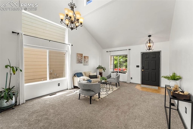 5481 Pioneer Mesa Dr, Colorado Springs, CO 80923 - carpeted living area featuring a chandelier and high vaulted ceiling