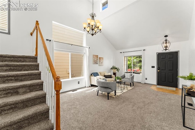 5481 Pioneer Mesa Dr, Colorado Springs, CO 80923 - living room featuring a chandelier, carpet, high vaulted ceiling, and stairway