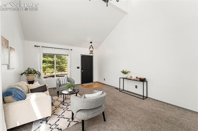 5481 Pioneer Mesa Dr, Colorado Springs, CO 80923 - living area with high vaulted ceiling, carpet floors, and a chandelier
