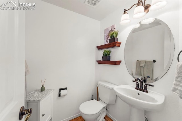 5481 Pioneer Mesa Dr, Colorado Springs, CO 80923 - half bath with toilet and wood finished floors