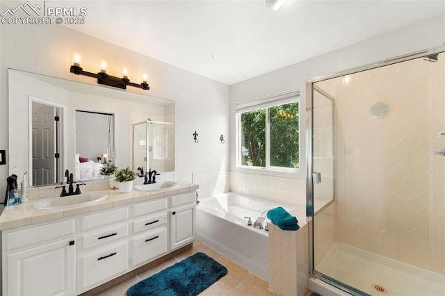 5481 Pioneer Mesa Dr, Colorado Springs, CO 80923 - bathroom featuring a stall shower, a garden tub, double vanity, and tile patterned floors