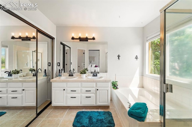 5481 Pioneer Mesa Dr, Colorado Springs, CO 80923 - full bath with double vanity, a garden tub, a shower stall, and tile patterned floors