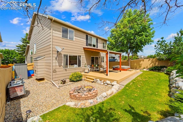 5481 Pioneer Mesa Dr, Colorado Springs, CO 80923 - back of house with an outdoor fire pit, a fenced backyard, and a deck