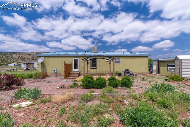 10 Ridgeway Dr, Williamsburg, CO 81226 - back of house with entry steps, a patio area, and metal roof