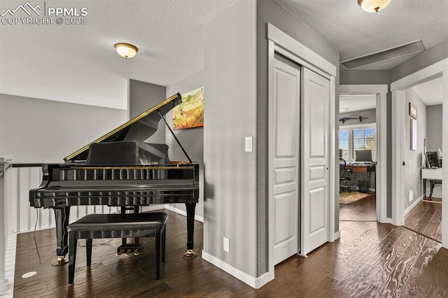 2512 Willow Glen Dr, Colorado Springs, CO 80920 - sitting room featuring a textured ceiling, wood finished floors, baseboards, and an office area
