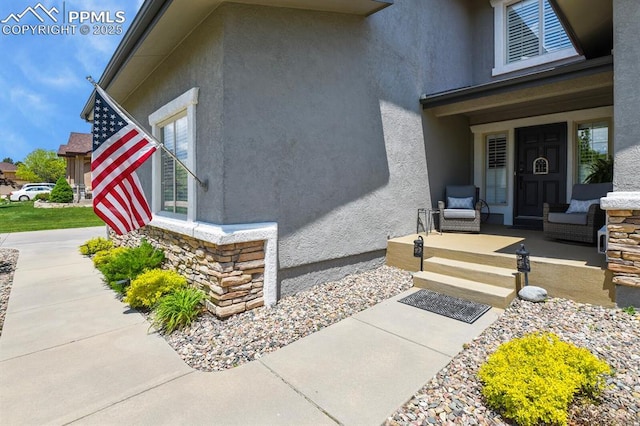 2512 Willow Glen Dr, Colorado Springs, CO 80920 - entrance to property featuring a porch and stucco siding