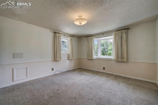 130 Cresta Rd, Colorado Springs, CO 80906 - carpeted spare room with a textured ceiling and baseboards