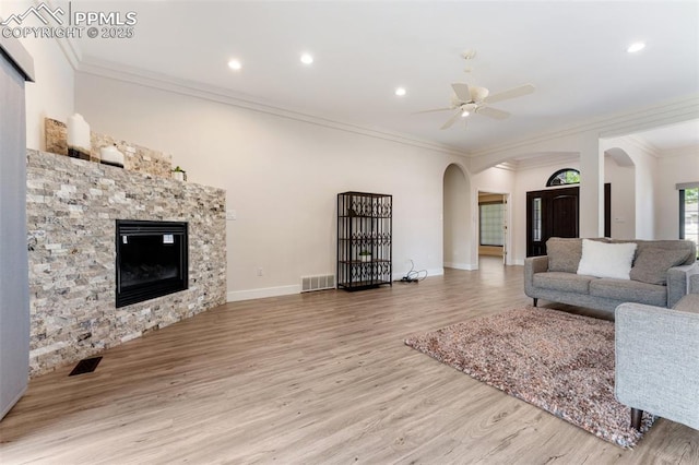 24 Redondo Ln, Pueblo, CO 81005 - living area with arched walkways, a ceiling fan, wood finished floors, ornamental molding, and recessed lighting