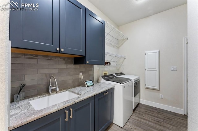 24 Redondo Ln, Pueblo, CO 81005 - laundry area featuring separate washer and dryer, dark wood finished floors, baseboards, and cabinet space