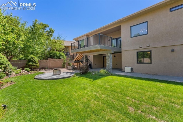24 Redondo Ln, Pueblo, CO 81005 - rear view of house with a patio, stairway, a fire pit, and stucco siding