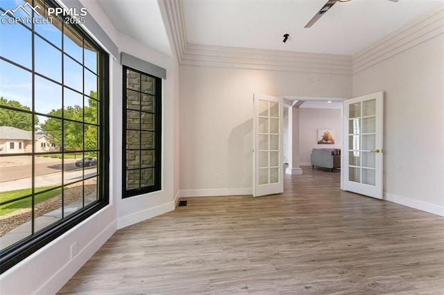 24 Redondo Ln, Pueblo, CO 81005 - unfurnished room featuring french doors, wood finished floors, baseboards, and a ceiling fan