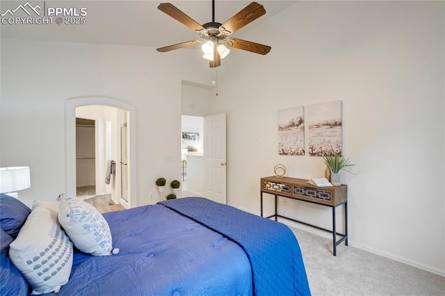 1020 Samuel Pt, Colorado Springs, CO 80906 - carpeted bedroom with arched walkways, baseboards, high vaulted ceiling, a ceiling fan, and ensuite bathroom