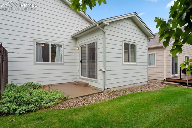 1020 Samuel Pt, Colorado Springs, CO 80906 - back of house with a lawn, a patio, and a wooden deck