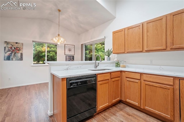 1020 Samuel Pt, Colorado Springs, CO 80906 - kitchen with black dishwasher, a sink, vaulted ceiling, a peninsula, and a chandelier