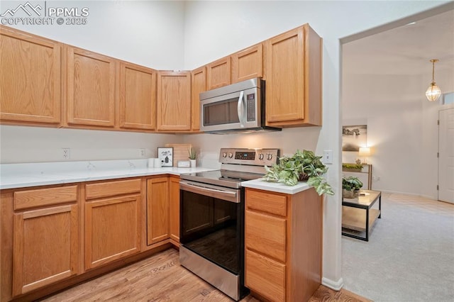 1020 Samuel Pt, Colorado Springs, CO 80906 - kitchen featuring appliances with stainless steel finishes, light countertops, and light brown cabinets
