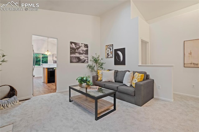 1020 Samuel Pt, Colorado Springs, CO 80906 - living room with light carpet, baseboards, and a towering ceiling