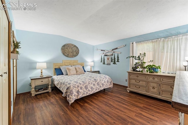 6150 Fall River Dr, Colorado Springs, CO 80918 - bedroom with dark wood-style floors, lofted ceiling, a textured ceiling, and baseboards