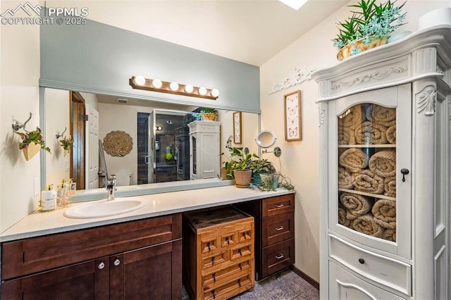 6150 Fall River Dr, Colorado Springs, CO 80918 - bathroom with vanity and a shower