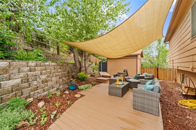 6150 Fall River Dr, Colorado Springs, CO 80918 - deck with outdoor lounge area and a fenced backyard