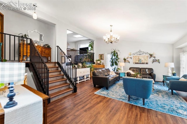 6150 Fall River Dr, Colorado Springs, CO 80918 - living room featuring a chandelier, wood finished floors, and stairway