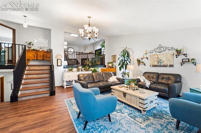 6150 Fall River Dr, Colorado Springs, CO 80918 - living area with wood finished floors, a chandelier, and stairway