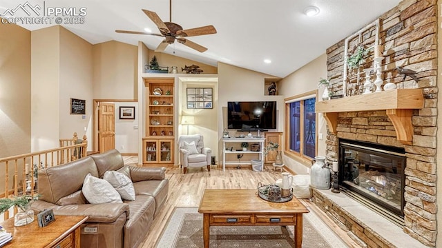 17910 Queensmere Dr, Monument, CO 80132 - living room with ceiling fan, a fireplace, recessed lighting, high vaulted ceiling, and wood finished floors