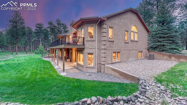 17910 Queensmere Dr, Monument, CO 80132 - rear view of house with a lawn, a patio, a wooden deck, and cooling unit