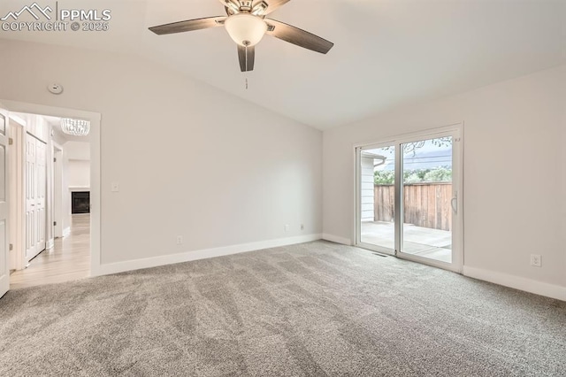 610 E San Gabriel Pl, Colorado Springs, CO 80906 - carpeted empty room with vaulted ceiling, baseboards, and ceiling fan