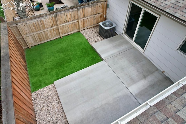 610 E San Gabriel Pl, Colorado Springs, CO 80906 - view of yard with central AC and a patio