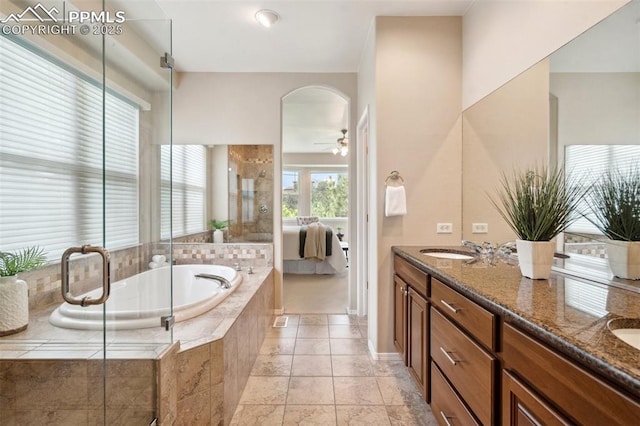 2175 Wake Forest Ct, Colorado Springs, CO 80918 - bathroom with a garden tub, double vanity, connected bathroom, a stall shower, and a ceiling fan