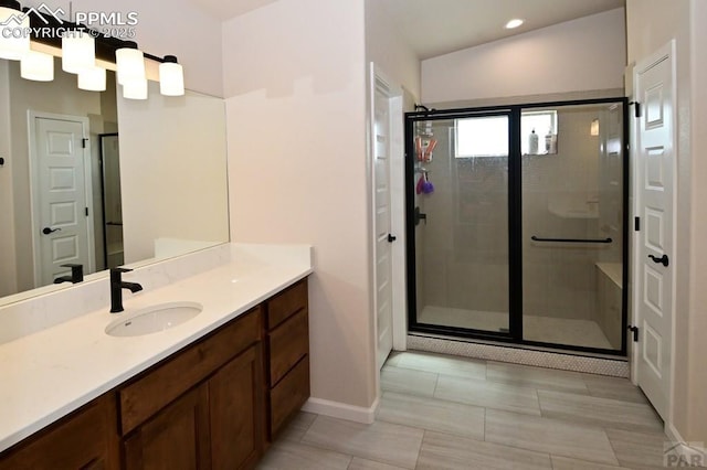 1213 E Tidy Dr, Pueblo, CO 81007 - full bathroom featuring a shower stall, vanity, baseboards, and recessed lighting