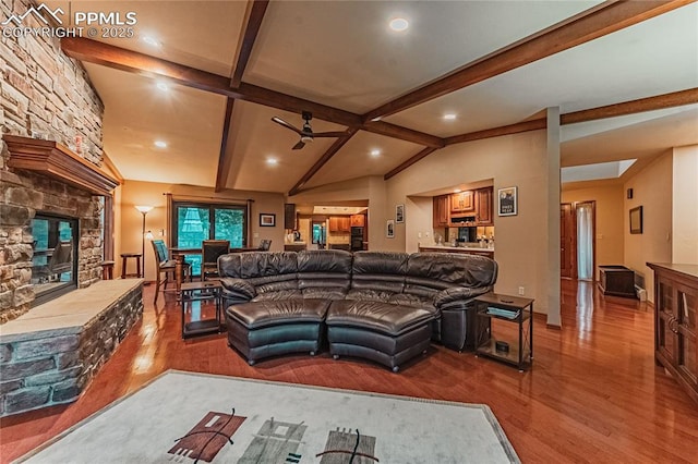5145 Golden Hills Ct, Colorado Springs, CO 80919 - living room with a stone fireplace, wood finished floors, ceiling fan, and recessed lighting