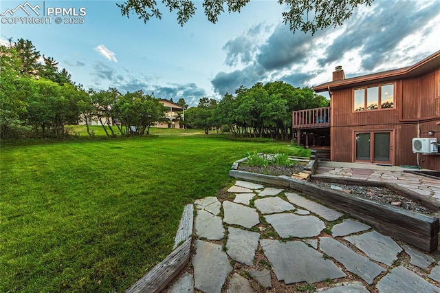 5145 Golden Hills Ct, Colorado Springs, CO 80919 - view of grassy yard featuring a cooling unit and a wooden deck