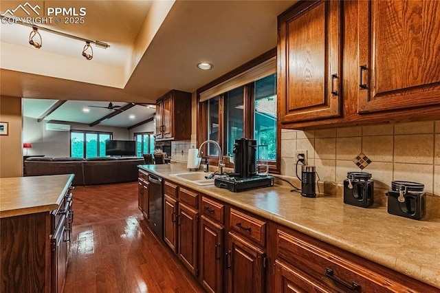 5145 Golden Hills Ct, Colorado Springs, CO 80919 - kitchen featuring a sink, dishwasher, dark wood finished floors, backsplash, and a ceiling fan