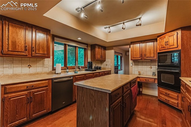 5145 Golden Hills Ct, Colorado Springs, CO 80919 - kitchen featuring black appliances, a sink, dark wood finished floors, backsplash, and light countertops
