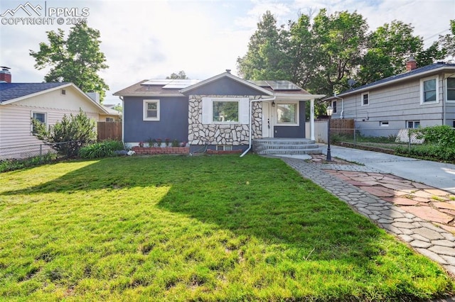 107 N Logan Ave, Colorado Springs, CO 80909 - bungalow-style house featuring roof mounted solar panels and stucco siding