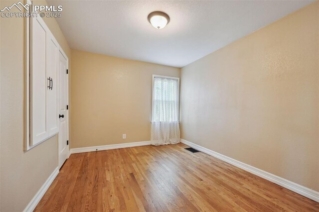 107 N Logan Ave, Colorado Springs, CO 80909 - unfurnished room featuring light wood-type flooring and baseboards