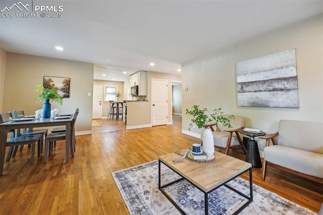 107 N Logan Ave, Colorado Springs, CO 80909 - living room with light wood-style flooring, baseboards, and recessed lighting
