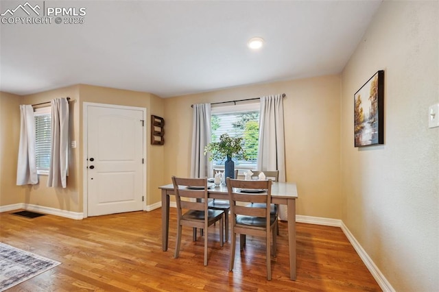 107 N Logan Ave, Colorado Springs, CO 80909 - dining room with light wood-type flooring and baseboards
