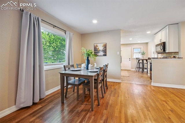 107 N Logan Ave, Colorado Springs, CO 80909 - dining area featuring light wood-style flooring, baseboards, and recessed lighting