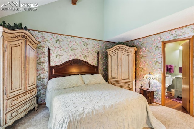 4835 Castledown Rd, Colorado Springs, CO 80917 - bedroom with lofted ceiling, wallpapered walls, and connected bathroom