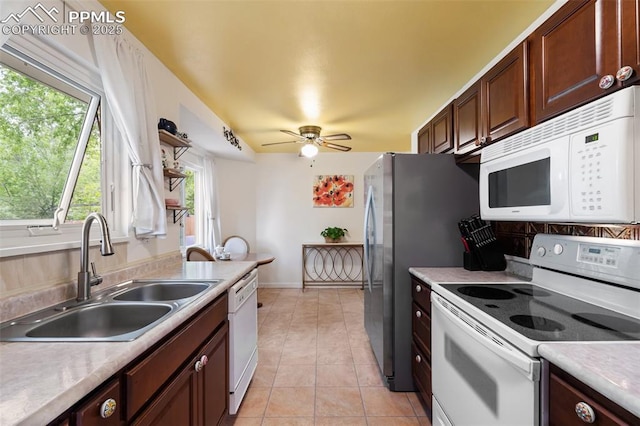 4534 Bella Dr, Colorado Springs, CO 80918 - kitchen featuring white appliances, a sink, a ceiling fan, and light countertops