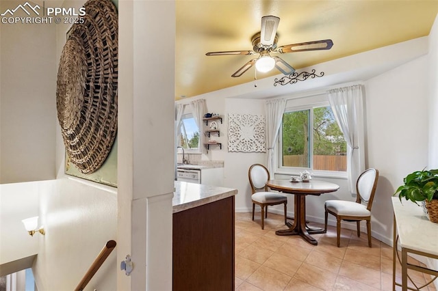 4534 Bella Dr, Colorado Springs, CO 80918 - dining area featuring a ceiling fan, light tile patterned floors, and baseboards