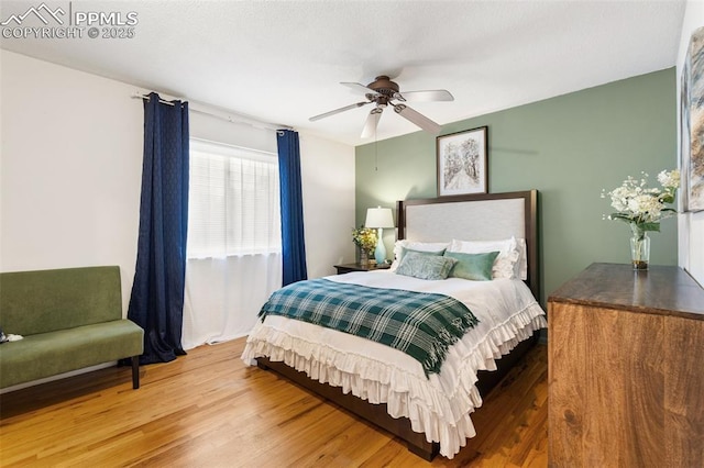 4534 Bella Dr, Colorado Springs, CO 80918 - bedroom with wood finished floors and ceiling fan