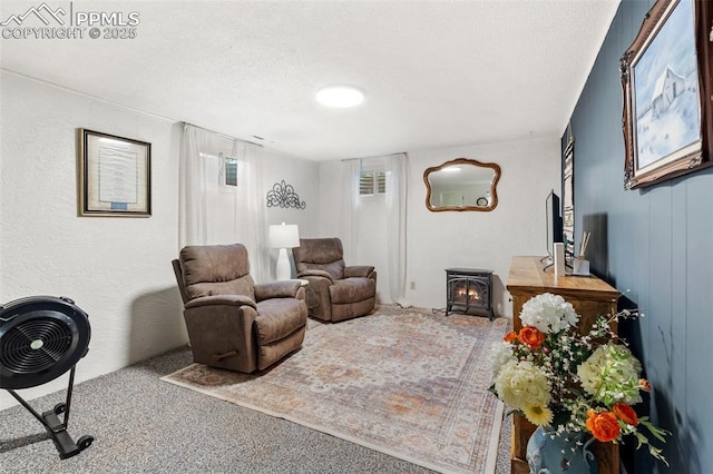4534 Bella Dr, Colorado Springs, CO 80918 - carpeted living area with a textured ceiling and a wood stove