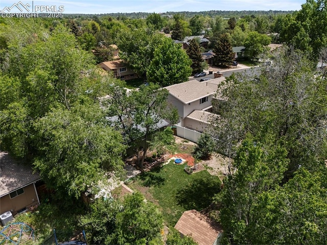4534 Bella Dr, Colorado Springs, CO 80918 - aerial overview of property's location with a heavily wooded area
